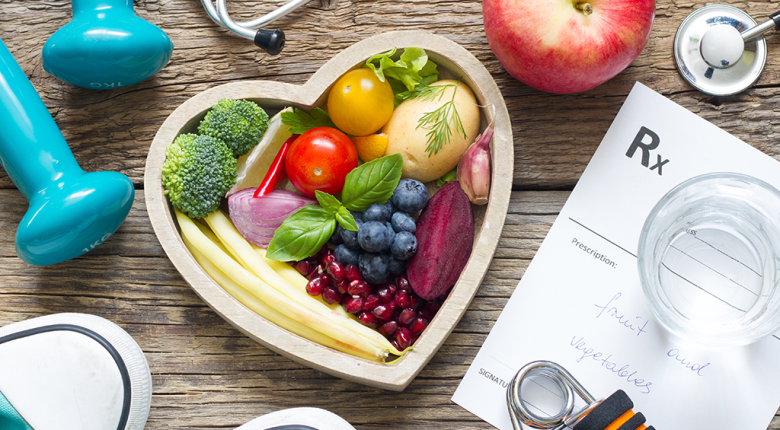 Heart Health Month promoting healthy habits like eating fruits and vegetables, exercising, and managing medications for better heart health.